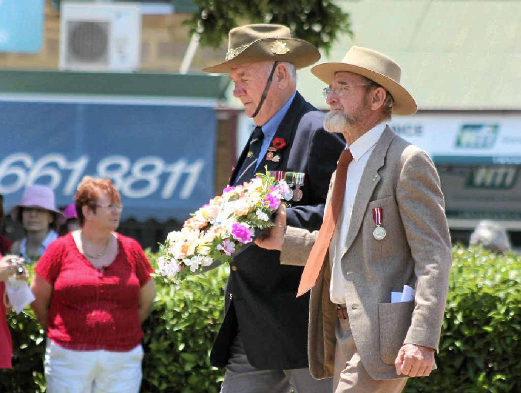 Warwick RSL Sub-branch committee members Tom Bryant and John Greacen laid a wreath at the Warwick Cenotaph last year. Mr Greacen will be the guest speaker at this year’s Remembrance Day Service at 10.40am tomorrow. Warwick RSL Sub-branch committee members Tom Bryant and John Greacen laid a wreath at the Warwick Cenotaph last year. Mr Greacen will be the guest speaker at this year’s Remembrance Day Service at 10.40am tomorrow.